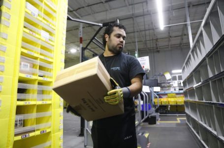 Amazon increases average pay for warehouse workers and adds free Prime membership perk